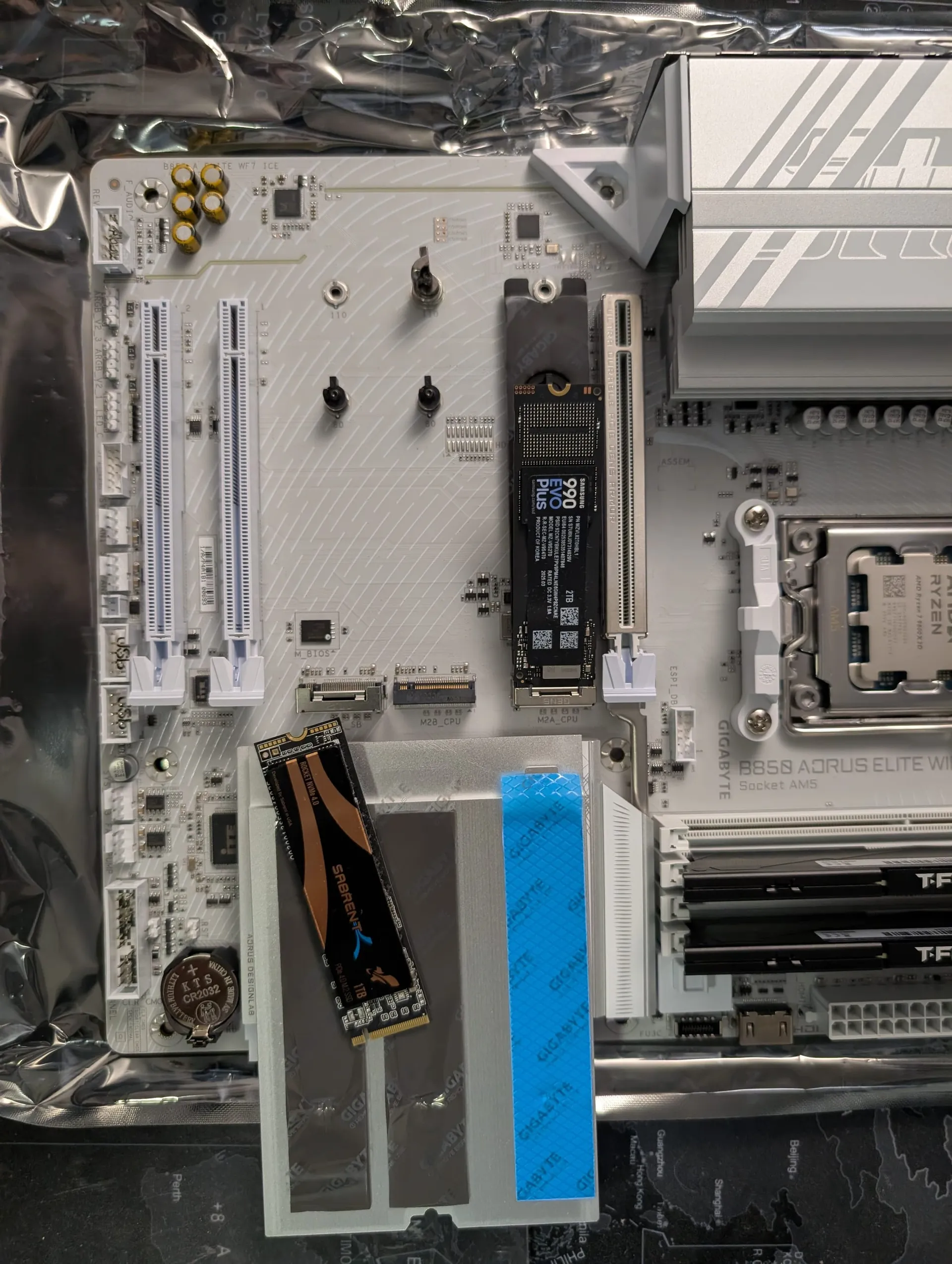 A picture displaying Installation of the 2X competing NVME drives into my new workstation "Dirty Snow".