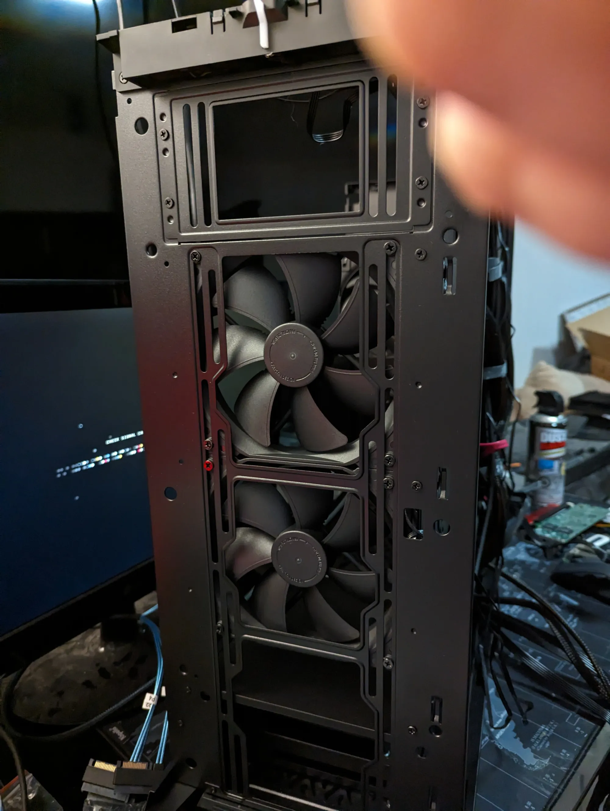 Close-up of the front fan intake array, showing the custom fan configuration pulling air directly across the hard drive cages.