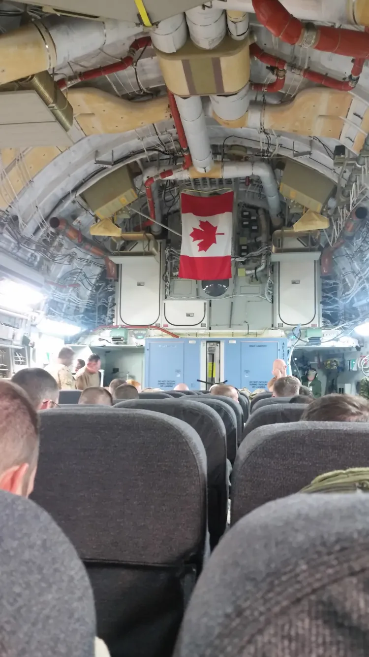 Internal view of a "PAX" configured C-17 Globemaster 3 with CAF personnel, in flight.
